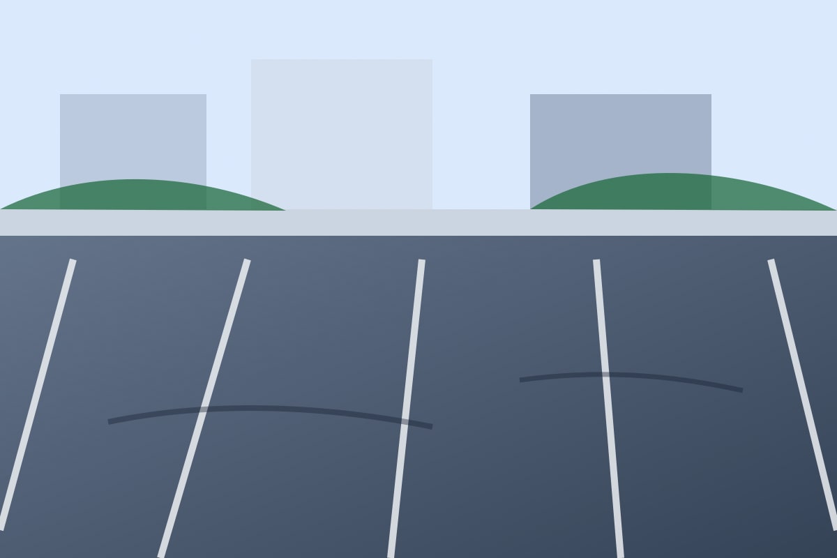 Empty parking lot with no vehicle visible — should fail.